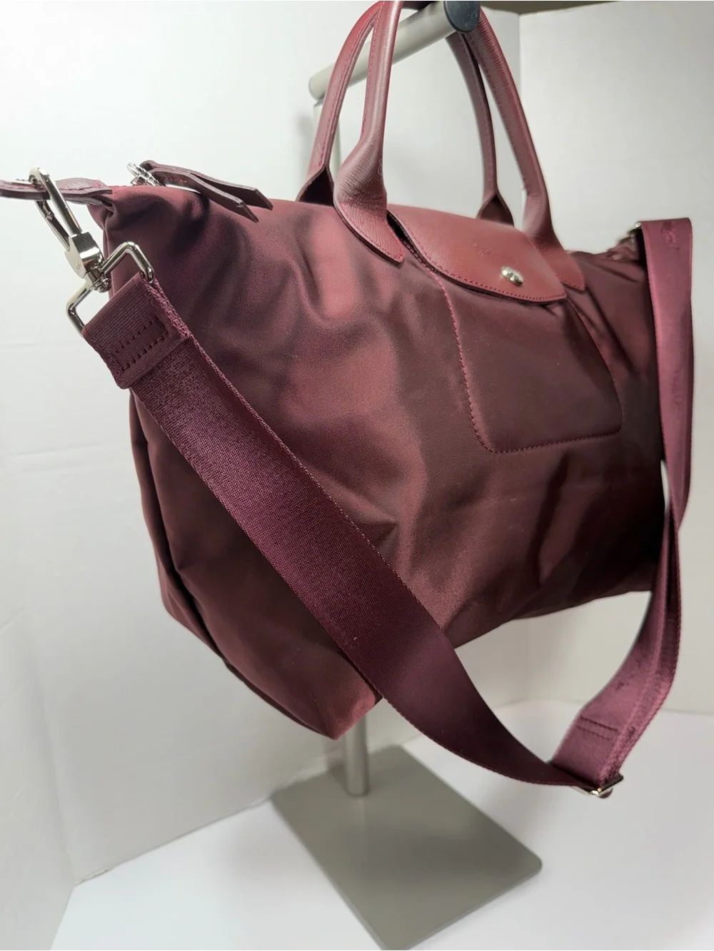LONGCHAMP Burgundy medium Le Pliage tote from LONGCHAMP featuring leather trim